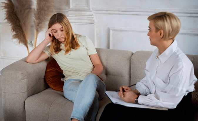 a woman talking to therapist