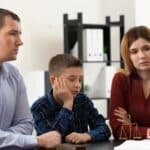 divorced parents with child doing consultation