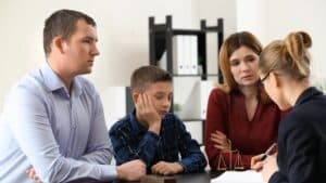 divorced parents with child doing consultation