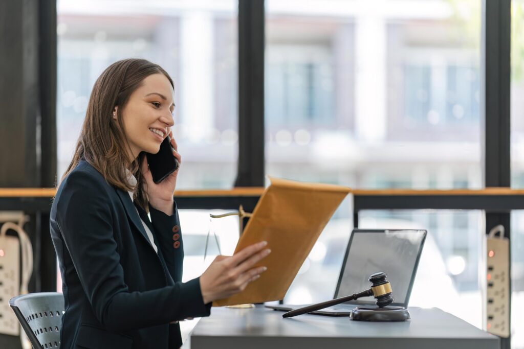 female lawyer in works in office or court, checks clients' contracts, female lawyer chats by phone. successful female lawyer, legal advice online
