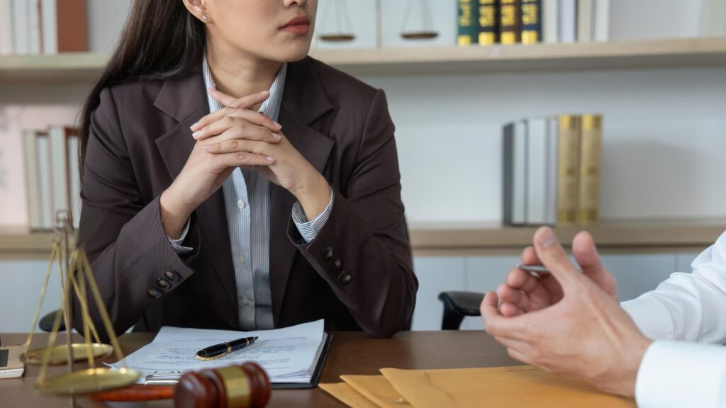 Professional Lawyer Meeting. Client listening attentively during legal consultation.