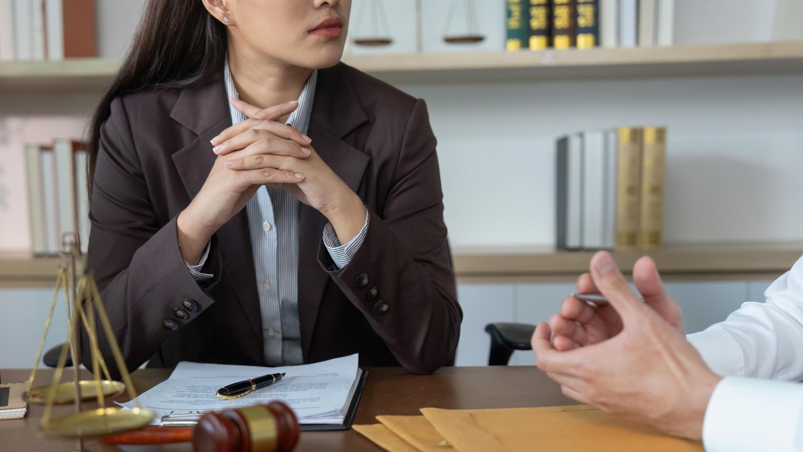 Professional Lawyer Meeting. Client listening attentively during legal consultation.