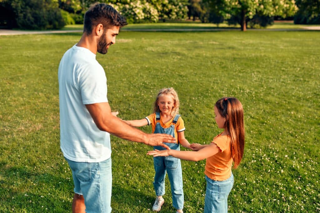 Cheerful father and child together in nature