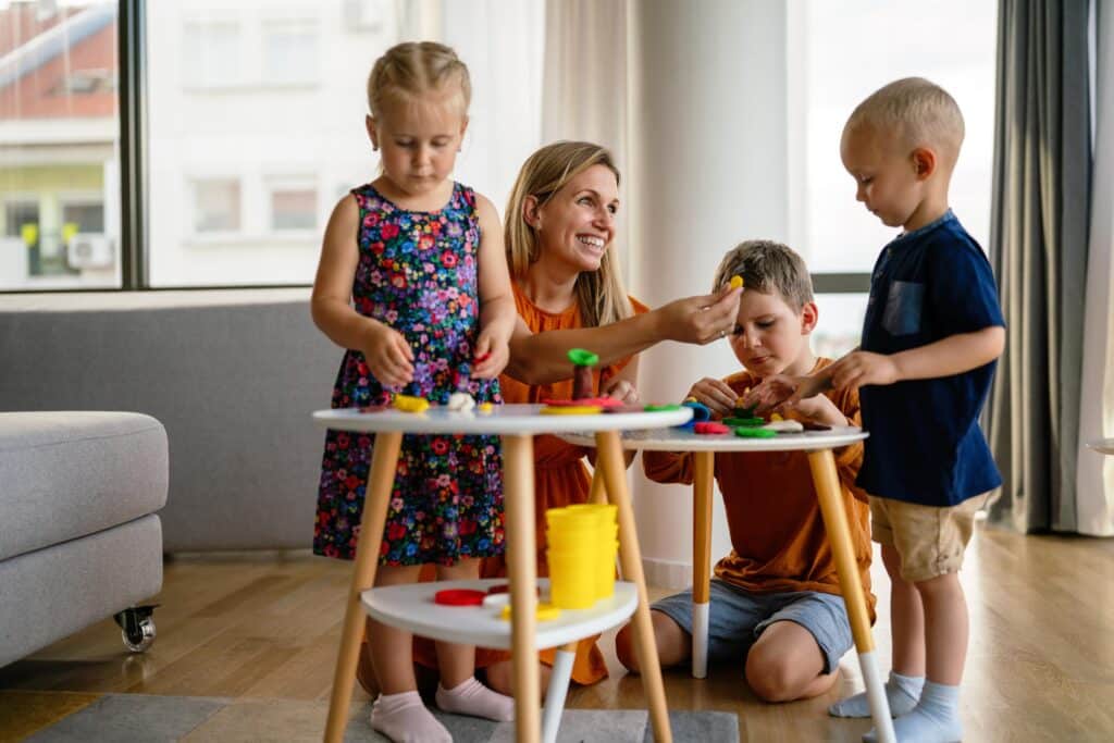 Mother and Children Playing Together with Colorful Dough